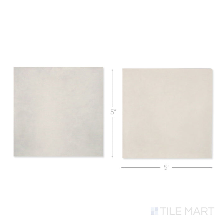 Top-down view of a single Village 5x5 silver mist and mushroom checkerboard glossy ceramic tile showing its light-reflective surface and two-tone finish detail