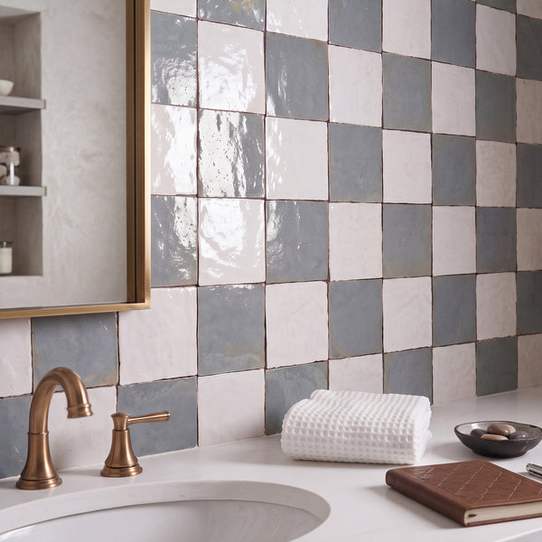 Zellige Classique in Atlas White and Gris Perle brings artisan glaze variation and vibrant color to a checkerboard wall.