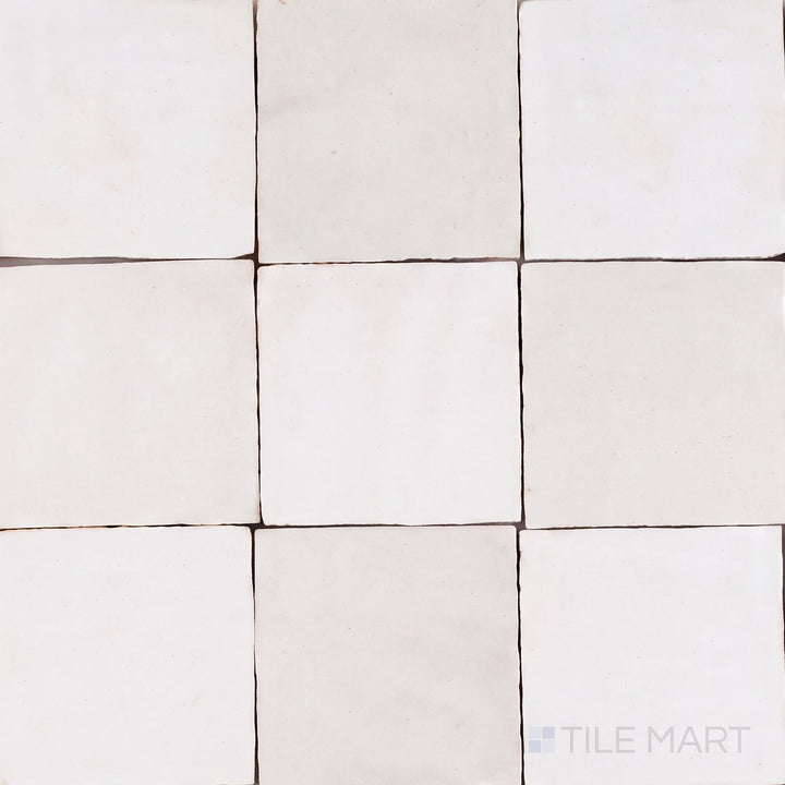 Overview of Zellige Classique 4x4 checkerboard in Atlas White and Lambswool, showing its hand cut glaze variation.