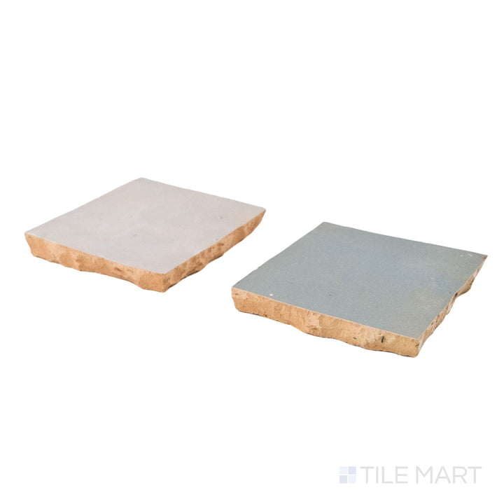 Corner shot of Zellige Classique tile in Lambswool and Gris Perle, revealing its hand cut edge and light-catching glaze.