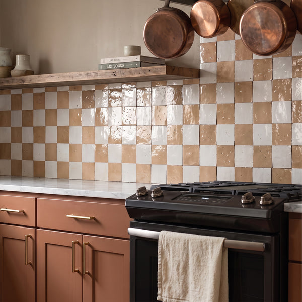 Zellige Classique in Lambswool and Sahara Rose brings artisan glaze variation and vibrant color to a checkerboard wall.