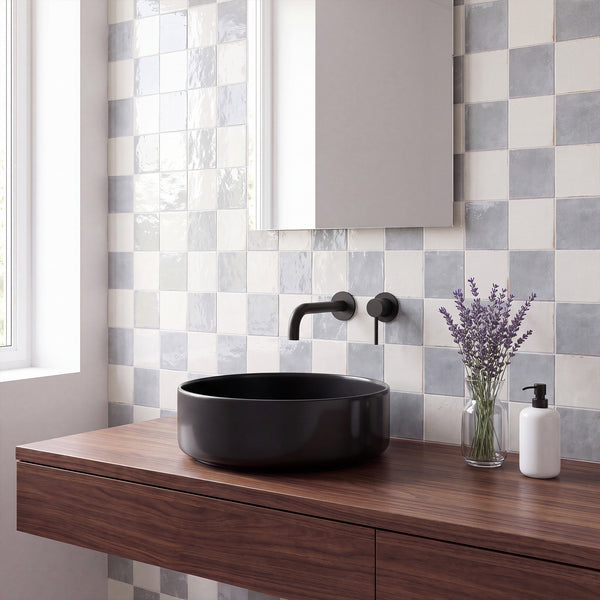 Agadir in Niebla and Piedra brings bold, vibrant color contrast to a bright porcelain checkerboard floor.
