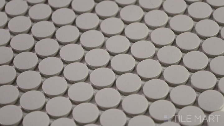 Video featuring Marin Pebble Gray 3/4" Penny Round Matte Glazed Porcelain Mosaic. A soft gray mosaic tile that blends seamlessly into modern and neutral interiors.