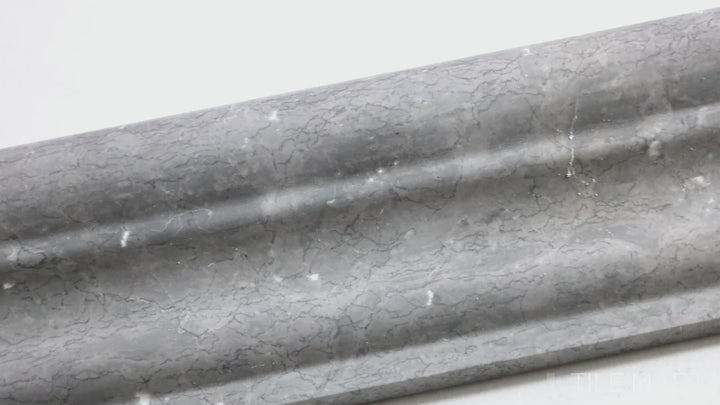 Video featuring Sto-Re Wooden Blue 2.5X12 Polished Marble Chair Rail. A Wooden Blue marble chair rail tile with a polished surface, perfect for a decorative border.