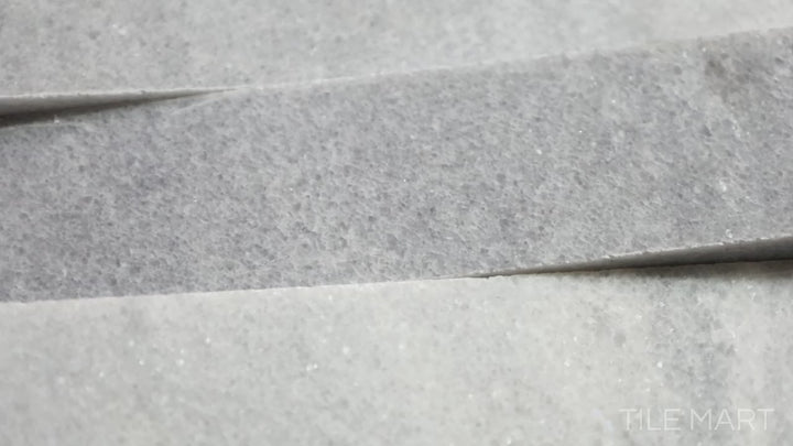 Video showcasing Rockmount Cosmic Gray 6X24 Stacked Stone Panel Honed Marble. A sleek gray marble panel with a smooth honed surface, offering timeless elegance.