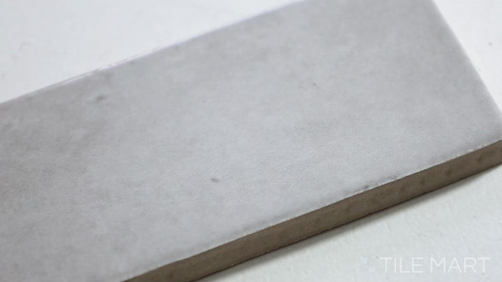 Video highlighting Soco Grey 2X6 Glossy Porcelain Tile. A sleek grey tile with a reflective glossy surface, adding depth and sophistication to walls and backsplashes.