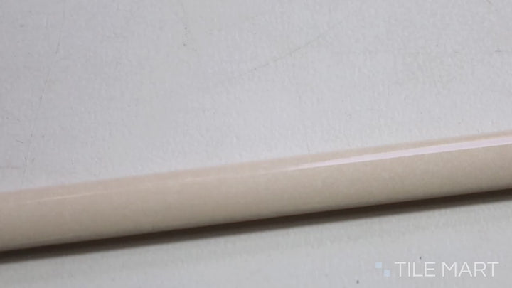 Video showcasing Village Mushroom 0.5X8 Glossy Ceramic Jolly Trim. A warm beige trim tile with a glossy sheen, ideal for seamless edging.