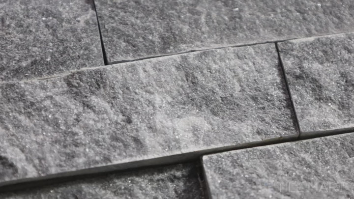 Video featuring Rockmount Cosmic Gray 6X24 Stacked Stone Panel Splitface Marble. A bold gray marble panel with a natural splitface finish, adding character to any space.