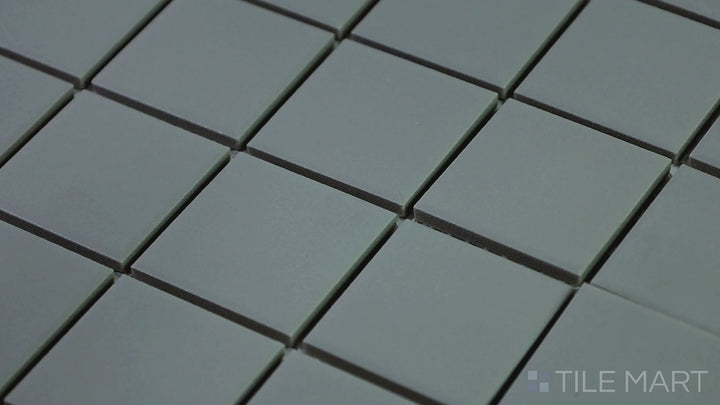 Video showcasing Marin Midnight Tide 2" Square Matte Glazed Porcelain Mosaic. A deep blue square mosaic tile with a soft matte finish, perfect for creating a bold and modern look.