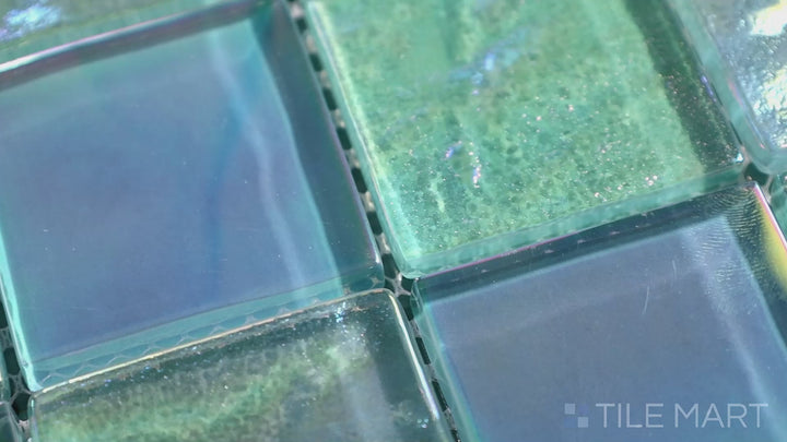 Video of Vidrofina Aguamarina 2" Square Glossy Glass Mosaic. A stunning aqua-toned glass tile with a brilliant glossy effect, ideal for creating a serene and ocean-inspired ambiance.