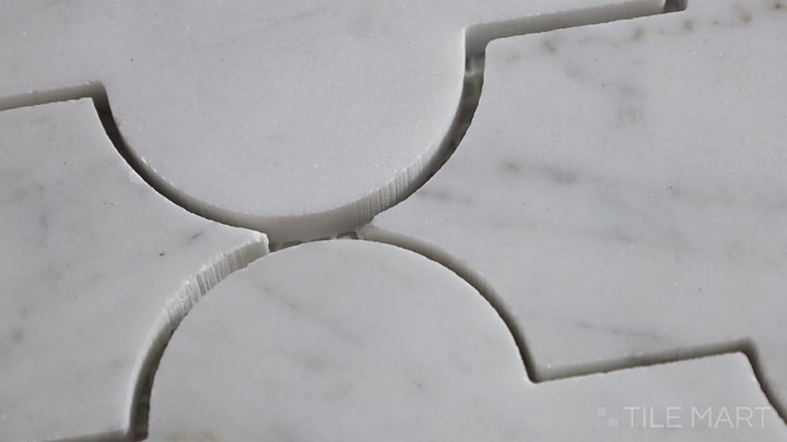 Video highlighting Sto-Re Carrara Marrakech Pattern Polished Marble Mosaic. Elegant Carrara marble with a polished surface, crafted into an artistic Marrakech pattern for a sophisticated statement.