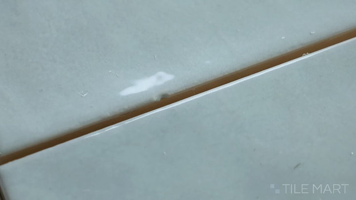 Video of Village Mint 5X5 Glossy Ceramic. A soft mint-green square tile with a glossy surface, creating a fresh, lively atmosphere.