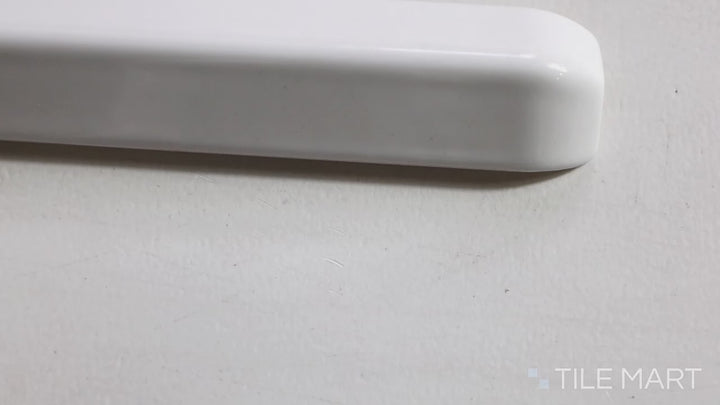 Video highlighting Sanitary Cove Base White 1x6 Glossy Ceramic Outside Corner. A glossy white ceramic outside corner tile, ensuring a refined and professional edge.
