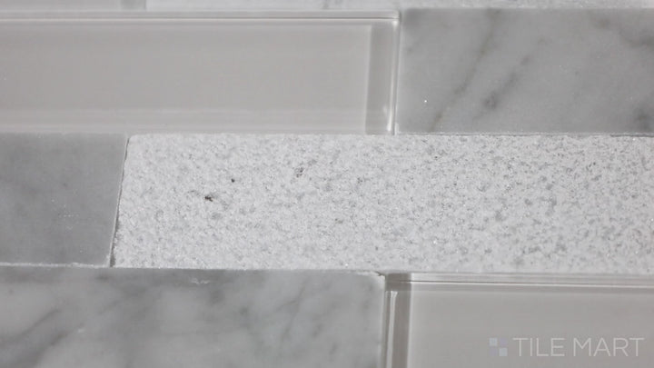 Video of Simplystick Mosaix Carrara White And Glass Blend Honed And Polished Marble, Limestone Mosaic. A luxurious Carrara white marble mosaic with a mix of honed and polished textures.