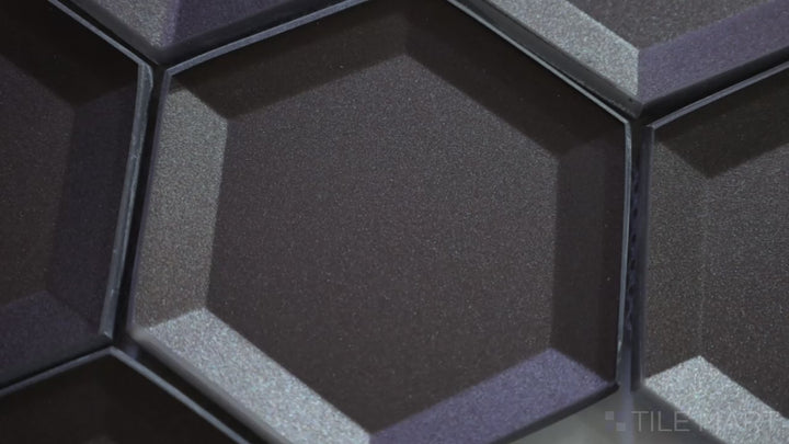Video featuring Bold Glass Black 3-inch Hexagon Glossy Mosaic. A deep black glass mosaic with a high-gloss finish, this tile enhances spaces with a bold, contemporary aesthetic and a refined hexagonal shape.