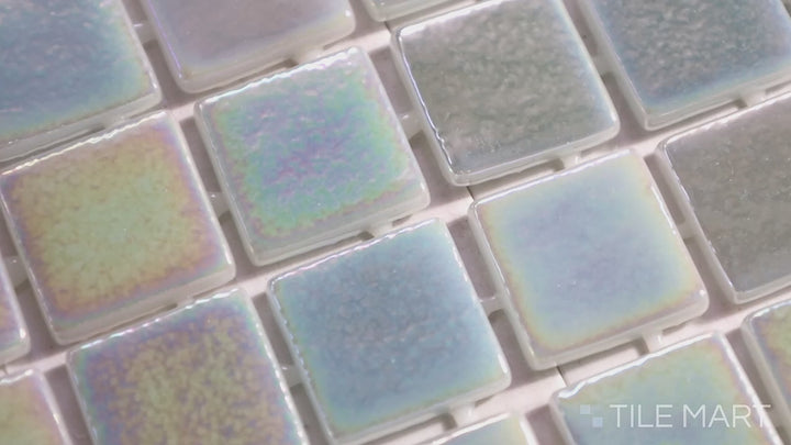 Video of Opalescent Claro Verde 1-inch Square Glossy Glass Mosaic. A soft green opalescent glass mosaic with a luminous glossy sheen, delivering a fresh and modern style.