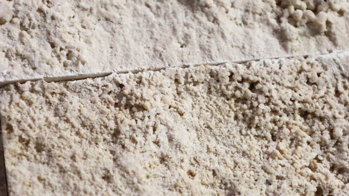 Video showcasing Rockmount Cream 6X24 Stacked Stone Panel Splitface Travertine. A warm, textured travertine panel that adds elegance and depth to any space.