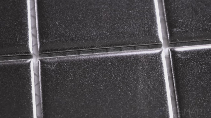 Video featuring Porcelain Glazed Mosaics Black 2-inch Square Matte. A bold black matte porcelain square mosaic with a smooth surface, adding depth and contrast.