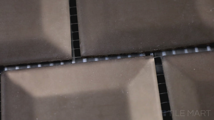 Video featuring Prism Bronze Has More Fun Rectangle Matte Glass Mosaic. A warm, earthy bronze tile with a matte glass finish, adding a playful yet sophisticated touch to interiors.