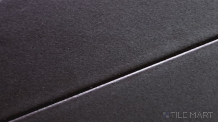 Video showcasing Zenia Orbit 2.5X9 Matte Glazed Porcelain. A deep charcoal matte tile with a bold presence, bringing sophistication to walls and backsplashes.