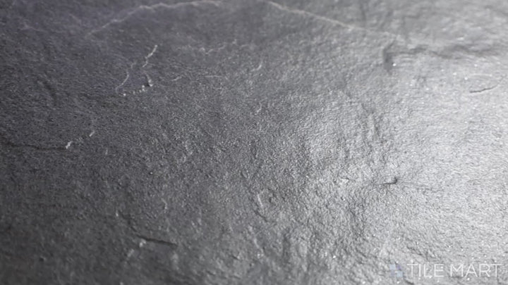 Video showcasing Ash Black 12x24 Matte Porcelain. A deep black porcelain tile with a smooth matte finish, offering a sleek and modern look with a refined surface.