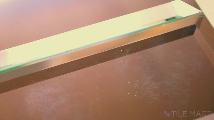 Video showcasing Glass Reflections Copper 4x12 Beveled Glossy. A warm copper-colored glass tile with a beveled glossy surface, delivering a bold and elegant metallic appeal.