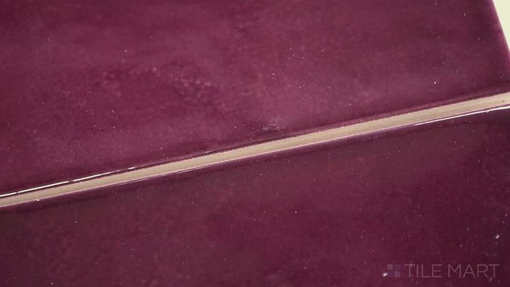 Video showcasing Village Aubergine 2.5X8 Glossy Ceramic. A deep purple subway tile with a glossy finish, adding drama and luxury to interiors.