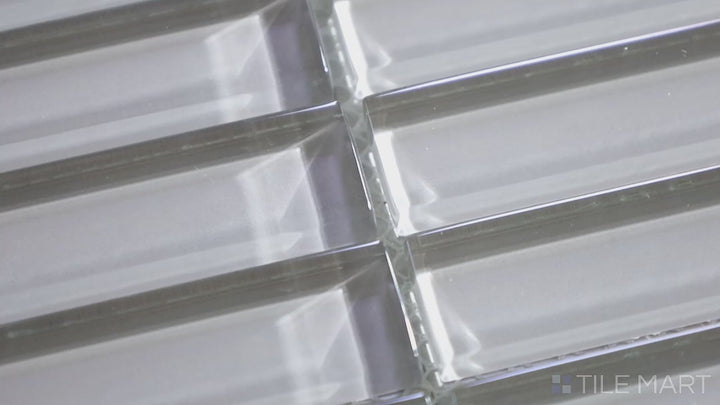 Video showcasing Glass Pastel Grey Grid Glossy Mosaic. A stylish pastel grey glass mosaic with a reflective glossy sheen, arranged in a neat grid format for a modern, sophisticated look.