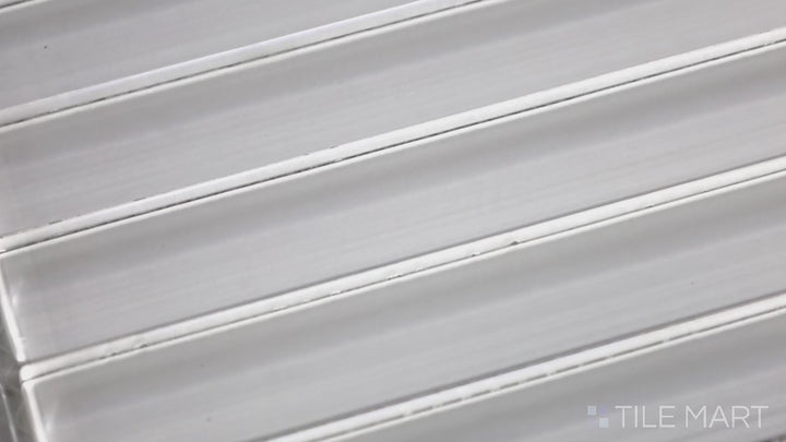 Video highlighting Glass Pastel White Grid Glossy Mosaic. A soft pastel white glass mosaic with a smooth glossy surface, arranged in a structured grid for a bright and airy feel.