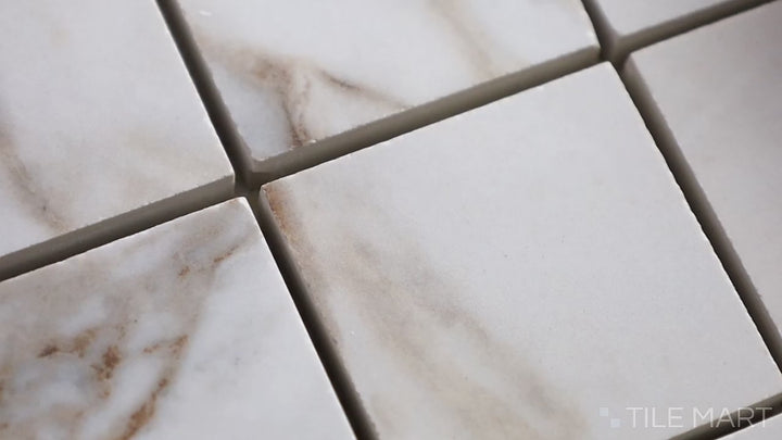 Video featuring Exotic Stone Cosmopolitan Arabescato 2-inch Square Polished Porcelain Mosaic. A refined white polished porcelain mosaic with intricate veining, inspired by classic Arabescato marble.