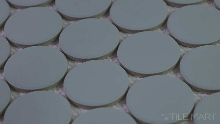 Video highlighting Marin Misty Blue 2" Penny Round Matte Glazed Porcelain Mosaic. A serene blue tile with a soft matte sheen, perfect for modern and spa-like spaces.