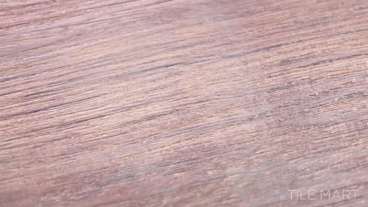 Video featuring Cyrus Braly 9X60 Low Gloss Luxury Plank Vinyl. A stylish vinyl plank with a natural wood aesthetic and subtle color variations.