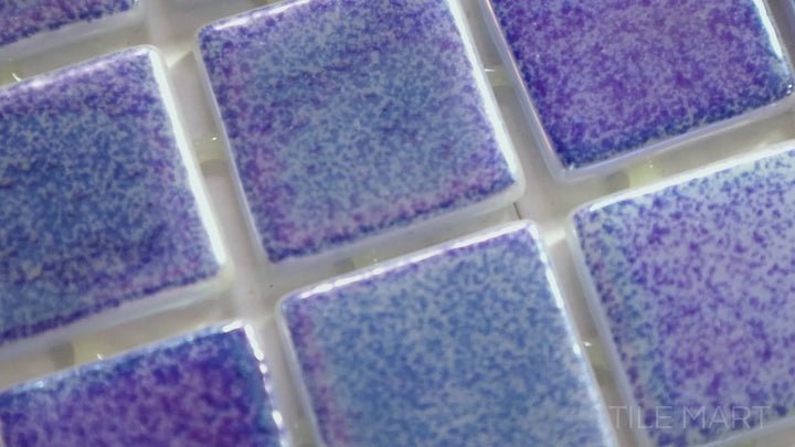 Video showcasing Opalescent Marino Azul 1-inch Square Glossy Glass Mosaic. A deep marine blue opalescent glass mosaic with a high-gloss surface, evoking an ocean-inspired elegance.