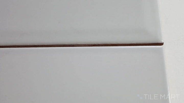 Video of Domino Gray 4X16 Glossy Porcelain. A large-format glossy gray tile that brings a sophisticated and polished look to walls and floors.