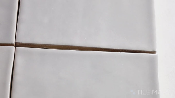 Video highlighting Marin Pebble Gray 4X4 Gloss Glazed Ceramic. A soft gray glossy tile with a timeless square design, ideal for modern and minimalist spaces.