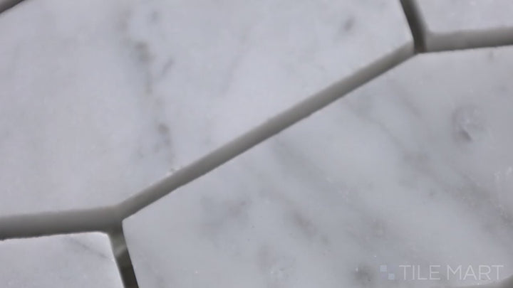Video featuring Sto-Re Carrara Elongated Hexagon Polished Marble Mosaic. A refined Carrara marble mosaic with an elongated hexagon shape, polished for a sleek appearance.