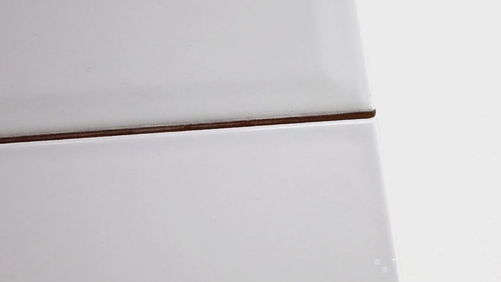 Video highlighting Domino Gray 3X6 Glossy Porcelain. A modern gray subway tile with a high-shine finish for contemporary and industrial-style spaces.