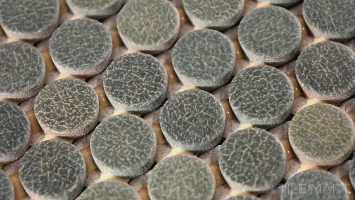 Video showcasing Inyo Olive Penny Round Matte Glazed Ceramic Mosaic. A soft olive green penny round tile that introduces a touch of nature-inspired beauty.
