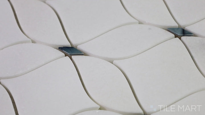Video showcasing D-Lux Pearl Grey Adley Polished Shell Marble Mosaic. A luxurious mosaic tile featuring polished shell and grey marble accents, perfect for elevating interior designs.