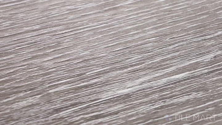 Video highlighting Cyrus Jenta 7X48 Low Gloss Luxury Plank Vinyl. A warm wood-look luxury plank with a soft matte finish, adding comfort and style to any room.