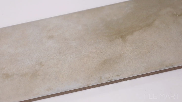 Video of Organic Clay Sand 2X10 Matte Ceramic. A soft, neutral-toned tile with a smooth matte surface, perfect for rustic and contemporary interiors.