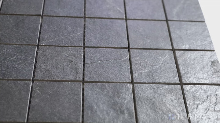 Video featuring Ash Black 2-inch Square Matte Porcelain Mosaic. A deep black porcelain mosaic tile with a matte surface, designed for a modern and uniform appearance.