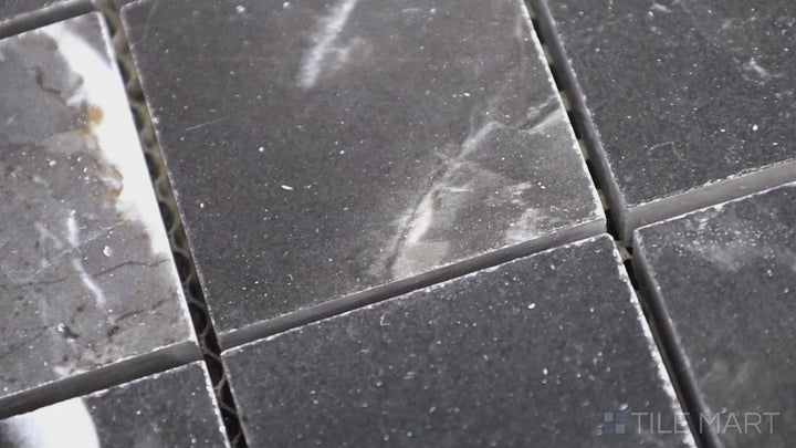 Video featuring Tele Di Marmo Revolution Calacatta Black 2" Square Polished Porcelain Mosaic. A high-gloss black marble-inspired mosaic with striking white veining for a bold aesthetic.