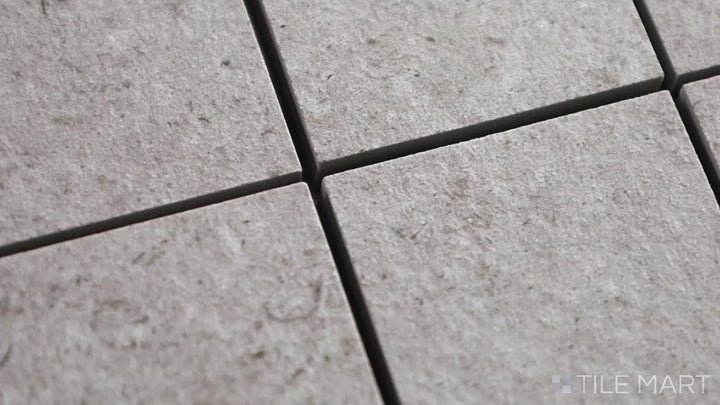 Video highlighting Epika Shell 2-inch Square Matte Porcelain Mosaic. A neutral shell-colored porcelain mosaic with a matte surface, blending classic and modern design elements.