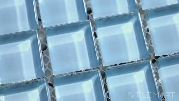 Video of Vidrofina Clarity Blue 1" Square Glossy Glass Mosaic. A soft blue glass mosaic with a glossy finish, creating a tranquil and luxurious aesthetic.