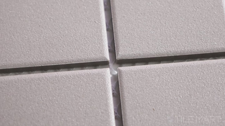 Video highlighting Solids Gray 2-inch Square Matte Porcelain Mosaic. A neutral gray matte porcelain square mosaic, blending modern simplicity with structured design.