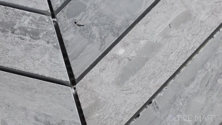 Video highlighting Sto-Re Wooden Blue Chevron Polished Marble Mosaic. A striking Wooden Blue marble mosaic with a chevron layout, polished for a smooth finish.