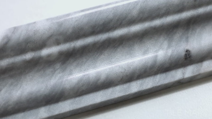 Video featuring Sto-Re Bardiglio 2.5X12 Polished Marble Chair Rail. A polished Bardiglio marble chair rail tile with a luxurious curved profile.