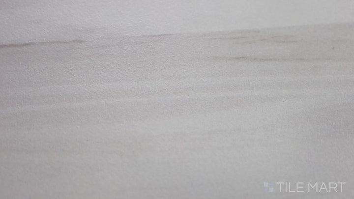 Video highlighting Eden Dolomite 12X24 Matte Porcelain. A soft white marble-look tile with a smooth matte surface, ideal for a minimalist aesthetic.