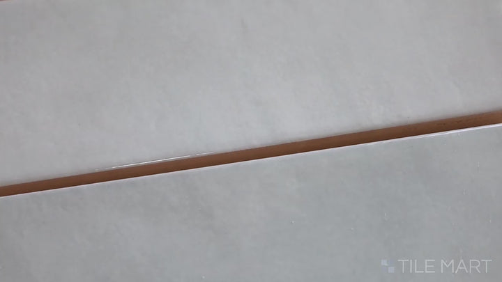 Video featuring Village Silver Mist 2.5X8 Glossy Ceramic. A muted silver subway tile with a high-gloss sheen, bringing a sleek modern touch.